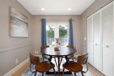 a dining room with a wooden table and chairs at Central Location Gym Hot Tub Villa in San Diego