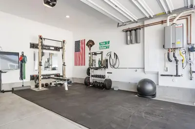 a room with a gym with a fitness room with equipment at Family home with Private Gym in Escondido