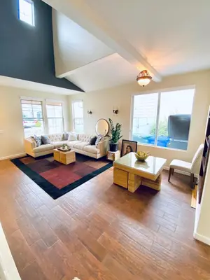 a living room with a couch and a table at Serene Beach Retreat in Encinitas