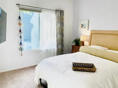 a bedroom with a bed and a window at Serene Beach Retreat in Encinitas