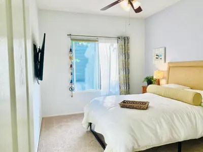 a bedroom with a bed and a window at Serene Beach Retreat in Encinitas