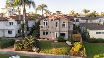 an aerial view of a house with palm trees at Walk to beach Great location Villa in San Diego