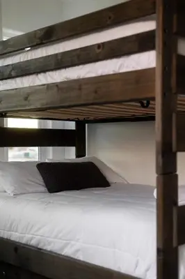 a bunk bed with a laptop on top of it at Walk to beach Great location Villa in San Diego