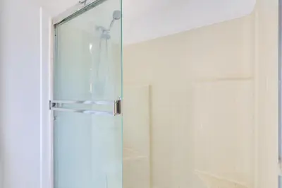 a shower with a glass door in a bathroom at 4 Mi to Shore Lake Elsinore Studio with Mtn Views in Lake Elsinore