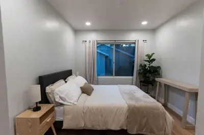 a bedroom with a large bed and a window at Relaxing Retreat in North Park in San Diego