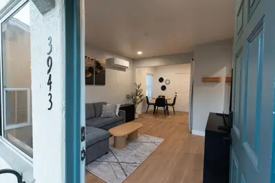 a living room with a couch and a table at Relaxing Retreat in North Park in San Diego