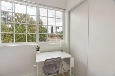 a white desk in a room with a window at Casita Full Kitchen-AC-Ping Pong in Escondido