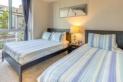 a bedroom with two beds and a window at Steps to Shore Condo with Resort Perks in Oceanside in Oceanside