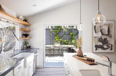 a kitchen with white countertops and a table with chairs at Entire home in La Jolla, CA in San Diego