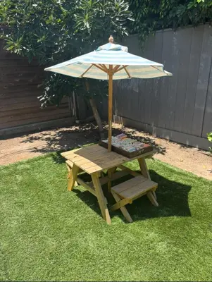 a picnic table and an umbrella on the grass at Entire home in La Jolla, CA in San Diego