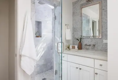 a bathroom with a shower with a sink and a mirror at Entire home in La Jolla, CA in San Diego