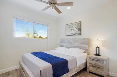 a bedroom with a bed and a ceiling fan at Charming Villa with Backyard Oasis Close to Beach in Laguna Hills