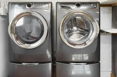 two washing machines sitting next to each other in a kitchen at Charming Villa with Backyard Oasis Close to Beach in Laguna Hills