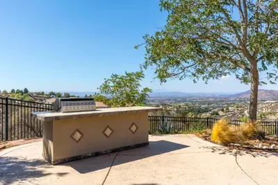 a laptop computer sitting on top of a cement table at Hilltop Getaway with Sunset Views in Temecula
