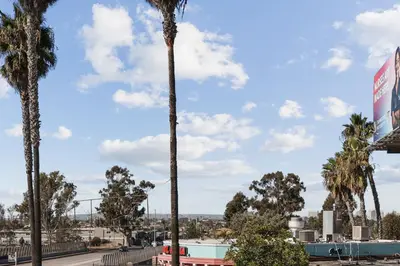 a palm tree in a parking lot at Modern Organic Getaway - New 2 Bed 2 Bath - Close to Beaches & Downtown in San Diego