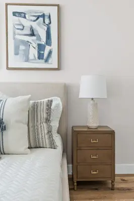 a bedroom with a bed and a nightstand with a lamp at Modern Organic Getaway - New 2 Bed 2 Bath - Close to Beaches & Downtown in San Diego