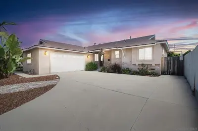 a large white house with a driveway at Modern SD Oasis with Pool & HotTub in San Diego