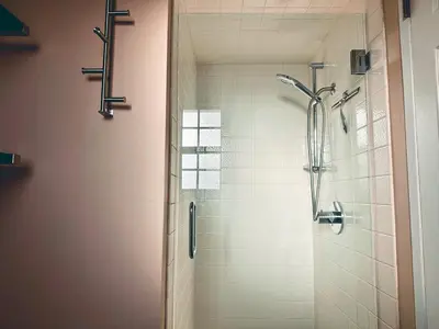 a bathroom with a shower with a glass door at Modern SD Oasis with Pool & HotTub in San Diego