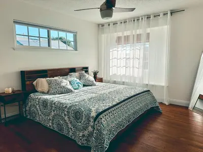 a bedroom with a bed and a ceiling fan at Modern SD Oasis with Pool & HotTub in San Diego