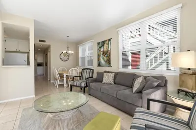 a living room with a couch and a table at 6Br Oceanview Getaway Steps From 27Th St Beach By Beachview Rentals in Newport Beach