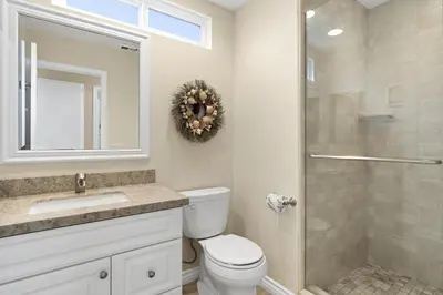 a bathroom with a toilet sink and a shower at 6Br Oceanview Getaway Steps From 27Th St Beach By Beachview Rentals in Newport Beach