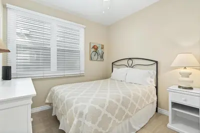 a bedroom with a bed and a window at 6Br Oceanview Getaway Steps From 27Th St Beach By Beachview Rentals in Newport Beach