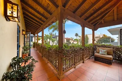 a wooden pergola with a couch on a patio at Oceanview Rooftop Escape Modern Spanish Decor in San Diego