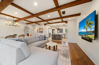 a living room with a couch and a table at Oceanview Rooftop Escape Modern Spanish Decor in San Diego
