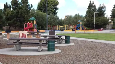 a park with picnic tables and a playground at Designer's Touch in San Diego