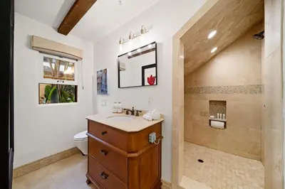 a bathroom with a sink and a shower at Majestic Corner Coastal Haven in San Diego