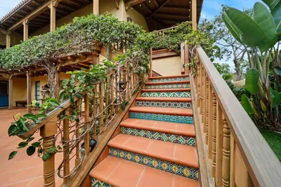 a set of stairs in a house with plants at Majestic Corner Coastal Haven in San Diego