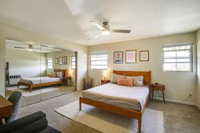 a bedroom with a bed and a mirror at Easy Beach and Airport Access! San Diego Getaway in San Diego
