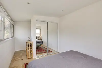 a bedroom with a bed and a mirror at Easy Beach and Airport Access! San Diego Getaway in San Diego