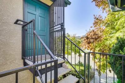 a blue door on a house with stairs at Easy Beach and Airport Access! San Diego Getaway in San Diego