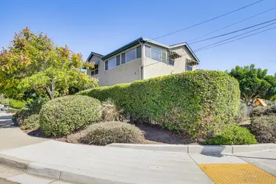 a large bush in front of a house at Easy Beach and Airport Access! San Diego Getaway in San Diego
