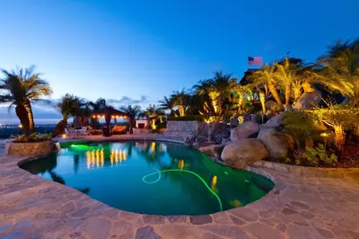 a swimming pool in a resort at night at North County Oasis in Vista