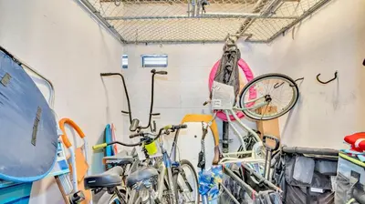 a group of bikes parked next to a wall at Beach - Walk - Village - Pool - Spa - Gym - Resort in Carlsbad