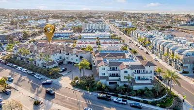 an aerial view of a city with buildings at Beach - Walk - Village - Pool - Spa - Gym - Resort in Carlsbad