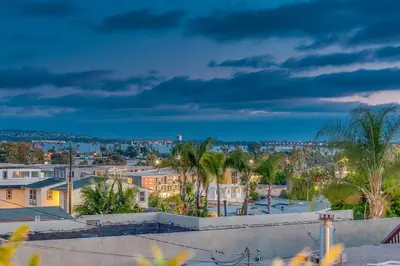a view of a city with palm trees and buildings at Comfy Bay Park Cottage close to Everything! in San Diego