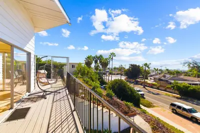 a balcony with a view of a street at PB Ocean Views - Garage, Parking, King Bed in San Diego