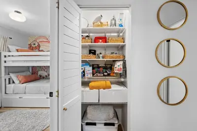 a room with a closet with white shelves and mirrors at NEW! Hot TubPoolFire Pit10 Mins to Beach in San Diego