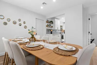 a dining room with a wooden table and chairs at NEW! Hot TubPoolFire Pit10 Mins to Beach in San Diego
