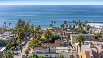 an aerial view of a city with palm trees and the ocean at La Jolla Villa by the Sea - Walk to Windansea in San Diego
