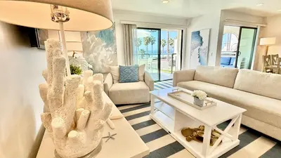 a living room with a couch and a table at Location! Location! Location! Walk Everywhere! in Oceanside