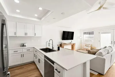 a kitchen with white cabinets and a white counter top at Luxury La Jolla Beach Retreat - Steps to Windansea in San Diego