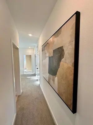 a hallway with a painting hanging on a wall at 4 Bed Large House in San Diego Amazing Amenities in Chula Vista