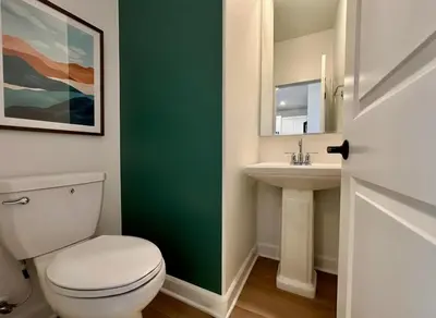 a bathroom with a white toilet and a sink at 4 Bed Large House in San Diego Amazing Amenities in Chula Vista