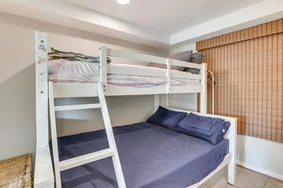 a room with two bunk beds and a bed at Walk to Mission Beach! Gem with Bay and City Views in San Diego