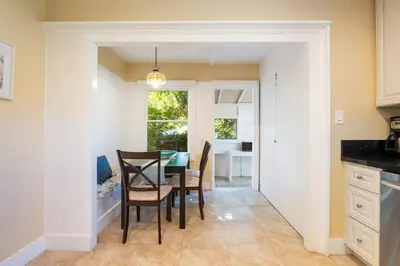 a kitchen and dining room with a table and chairs at La Jolla Village Escape - Walk to Everything in San Diego
