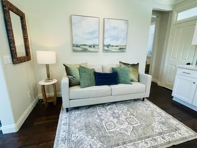 a living room with a couch and a rug at Newly Built Coastal Southern California Getaway in Carlsbad